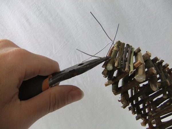 Close the twig stack and twist the wire to secure.